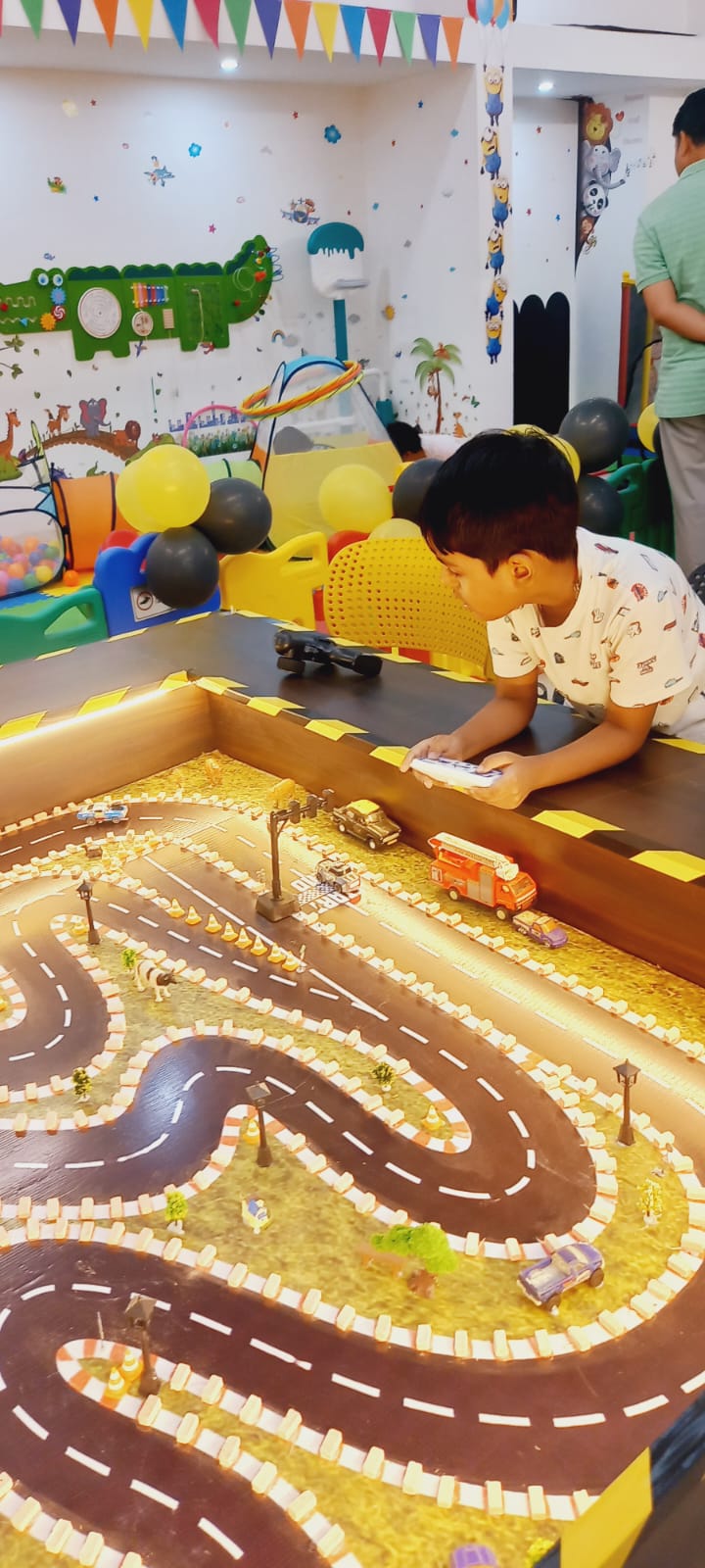 Mini racing RC track with a child playing