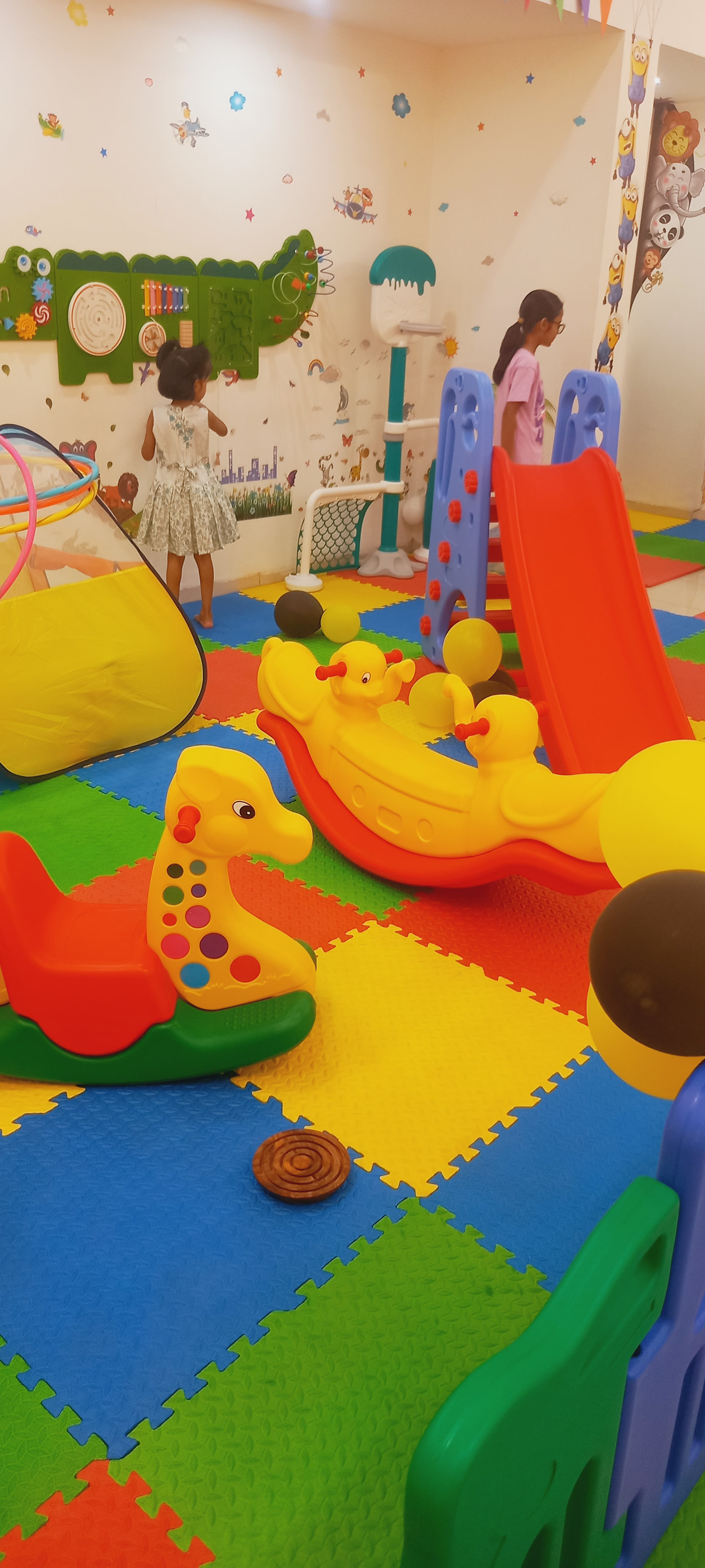 Colourful GAMES BOND kids playzone with slide, rocking toys, play tent, and activity wall